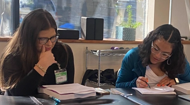 students reviewing workbook material students reviewing workbook material